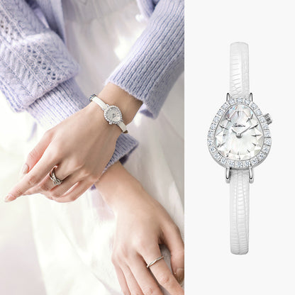 On-wrist lifestyle view of Sotoiru elegant ladies' watch: small dewdrop dial with white slim strap, perfect for women's daily fashion or formal occasions.