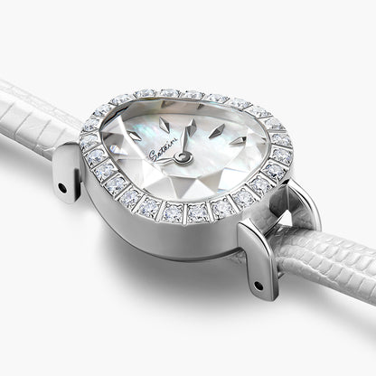 Close-up of Sotoiru women's watch: silver teardrop case with sparkling zircons, highlighting the iridescent mother-of-pearl dial and faceted prism crystal glass.
