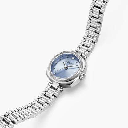 Close-up of Sotoiru Ice Blue Aura watch with light blue dial